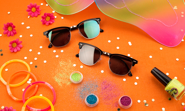 Two pairs of trendy sunglasses with black frames and dark lenses displayed on an orange background.
