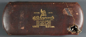 Brown leather case with the text: &quot;Estab 1876 E. B. Meyrowitz Inc. 104 East 23rd St. 237 Fifth Ave. 224 West 42nd St. 600 Madison Ave. London. Paris. New York.&quot; The case has a hole