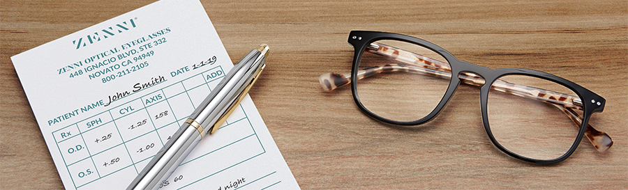 Zenni Optical Eyeglasses prescription form, pen, and tortoiseshell glasses on a wooden surface.
