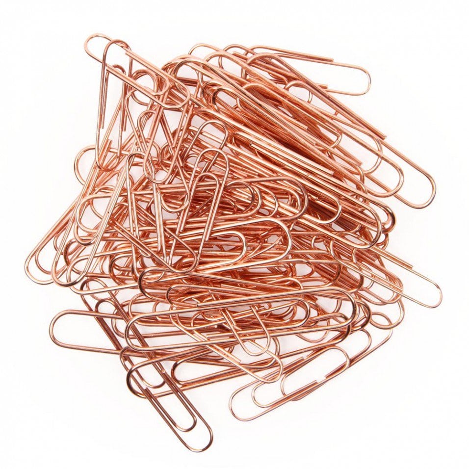 A pile of copper-colored paper clips.