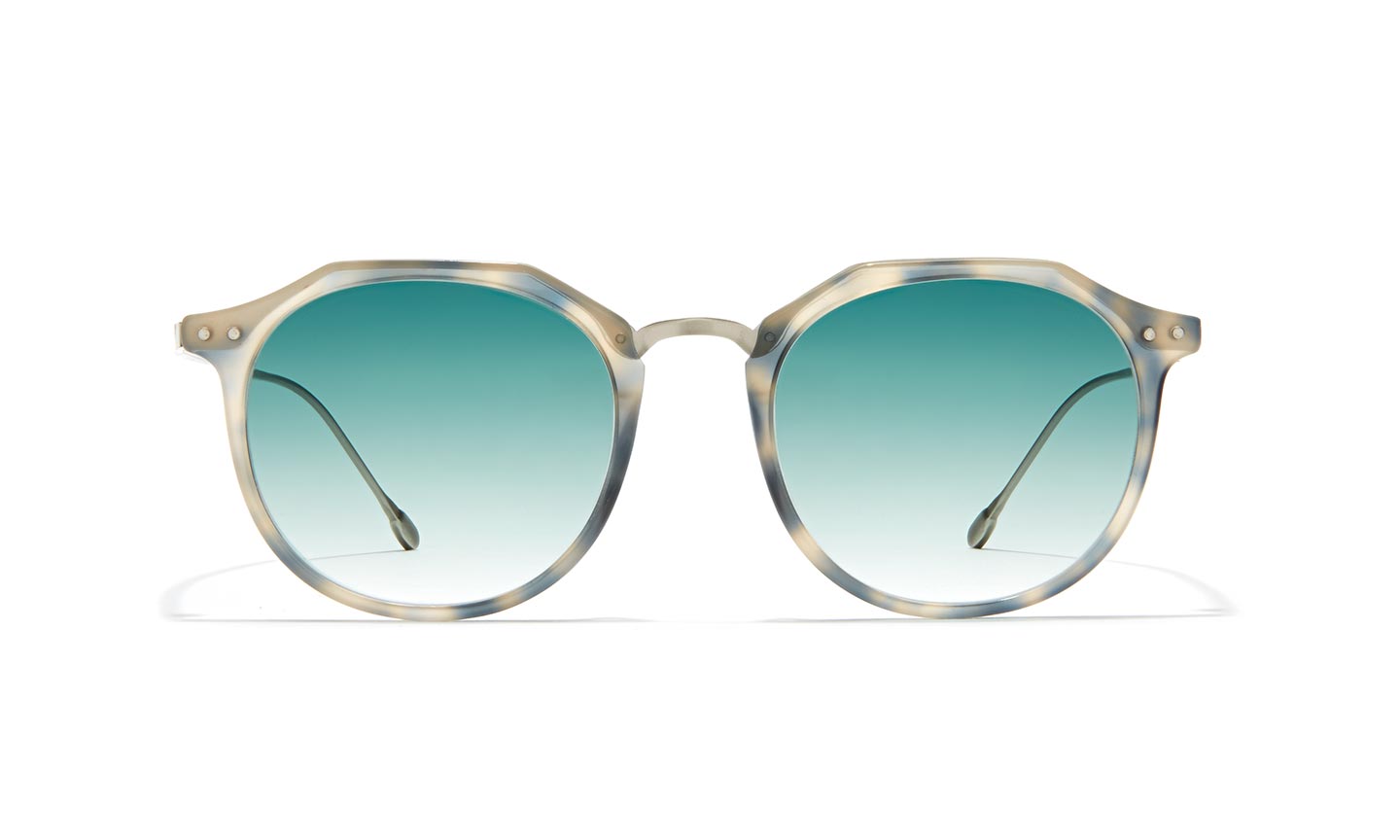 Round-frame sunglasses with gradient turquoise lenses and a light tortoiseshell acetate frame.