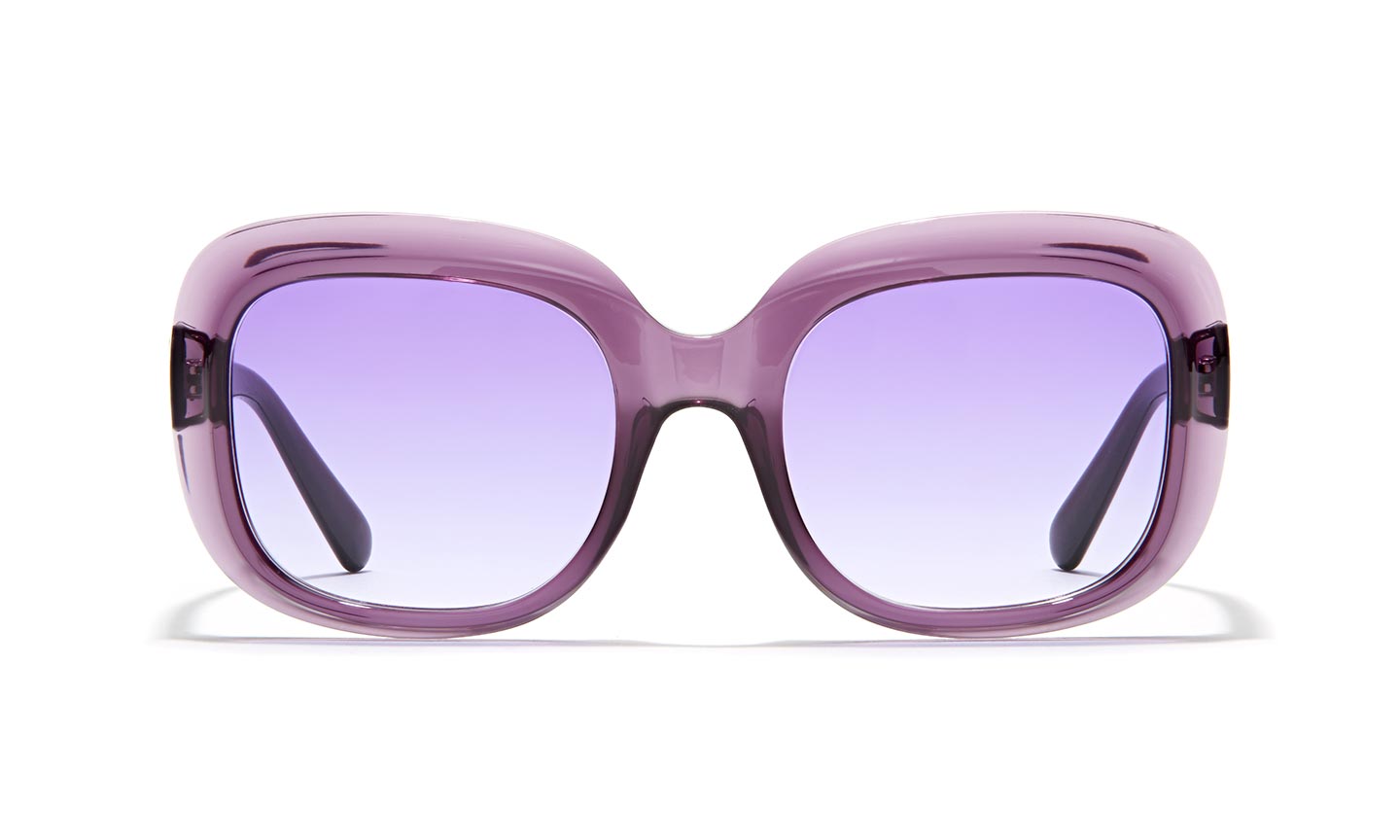 Purple oversized sunglasses with gradient lenses transitioning from purple to clear.