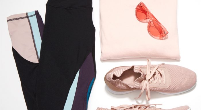 Black leggings with purple, pink, and blue accents, pink shoes, pink sweater, and rose-tinted sunglasses.