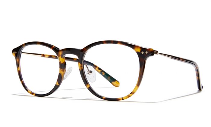Tortoiseshell round eyeglasses with silver metal temples and adjustable nose pads.