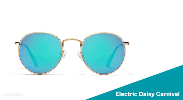Round sunglasses with blue-tinted lenses and thin gold frames. Text: “SKU 1127414 Electric Daisy Carnival”.