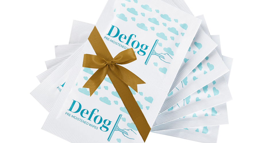 Defog pre-moistened wipes with a gold ribbon.