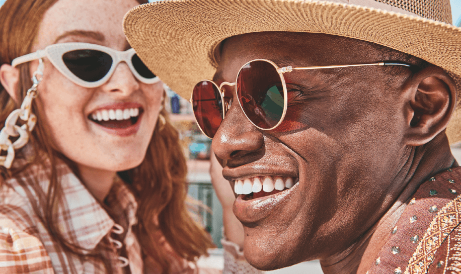 Image of a man and a woman wearing sunglasses