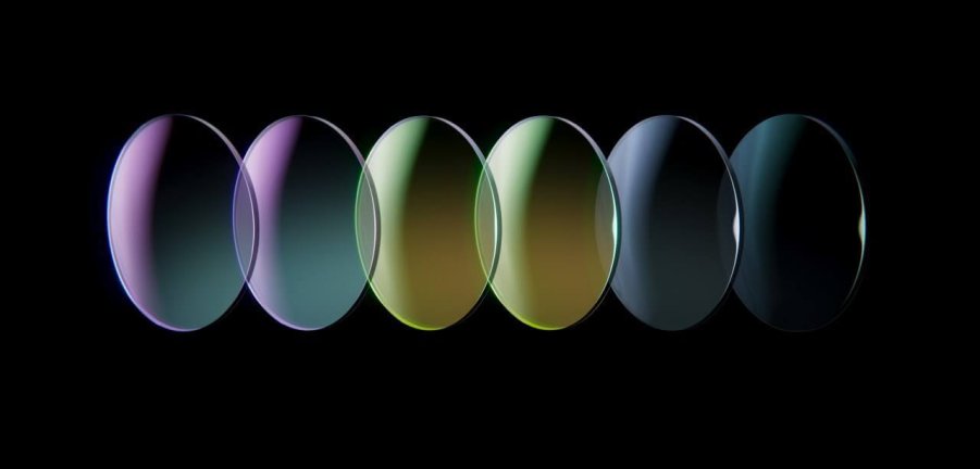 Six oval, iridescent nanocoatings ranging from purple to black against a black background.