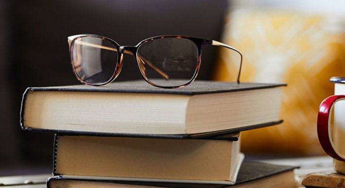 glasses on a set of books