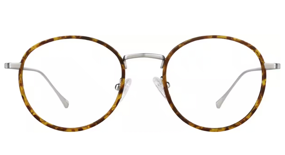 Round tortoiseshell eyeglass frame with silver nose bridge and clear nose pads.