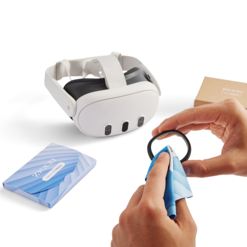 Virtual reality headset, cleaning a lens with a blue cloth; box labeled ZANEN Lens Cleaning Kit.