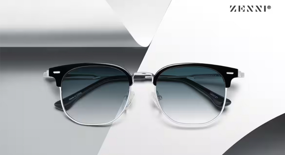 Zenni glasses with black upper rims, clear lower rims, and blue-tinted lenses. Text in image: ZENNI®.