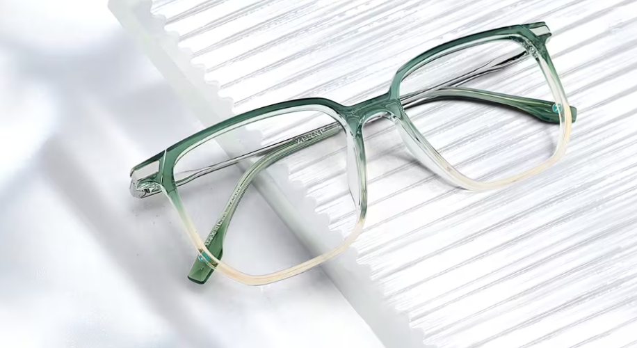 Green and clear rectangular eyeglasses with the brand name &quot;Silhouette&quot; on the temple.