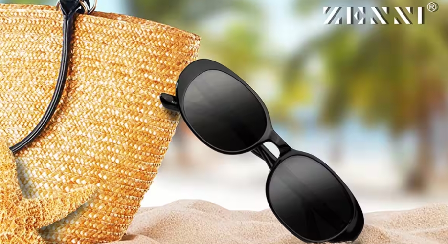Black sunglasses leaning against a straw beach bag. Text in the image: Zenni