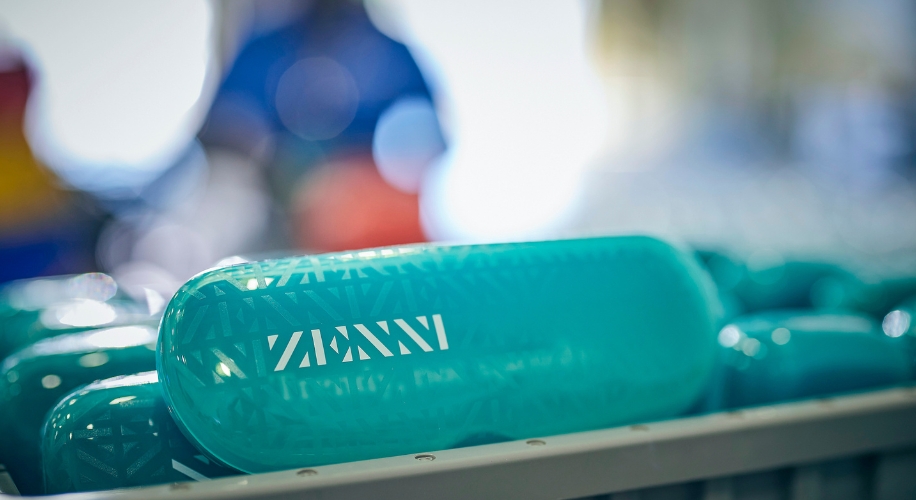 Turquoise eyeglass cases with &quot;ZENNI&quot; text in white.