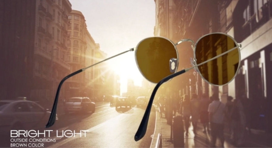 Sunglasses with brown lenses. Text: BRIGHT LIGHT OUTSIDE CONDITIONS BROWN COLOR.