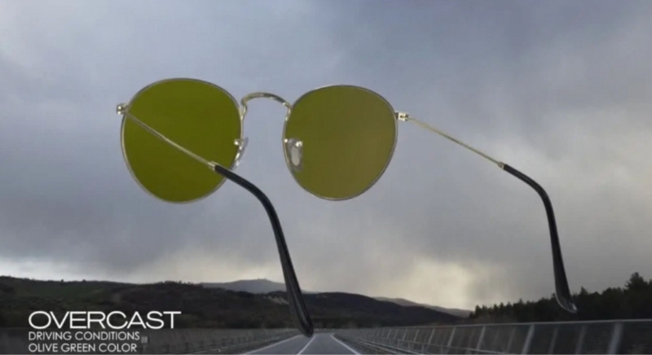 Sunglasses with olive green lenses. Text: &quot;OVERCAST DRIVING CONDITIONS OLIVE GREEN COLOR.&quot;
