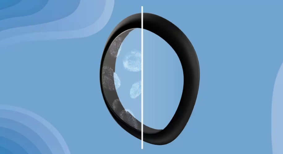 Black ring with fingerprint smudges on the left half, clean on the right half, against a blue background.