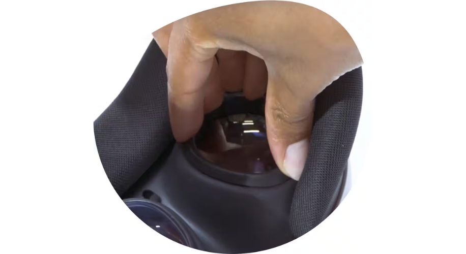 Hand adjusting lenses inside a virtual reality headset.