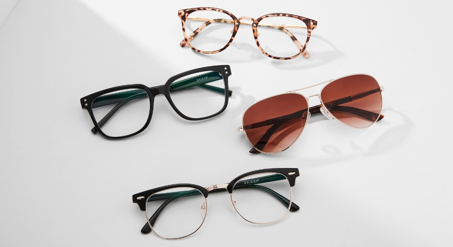 Four glasses from Zenni, including tortoiseshell, black square, aviator with brown lenses, and black round frames.