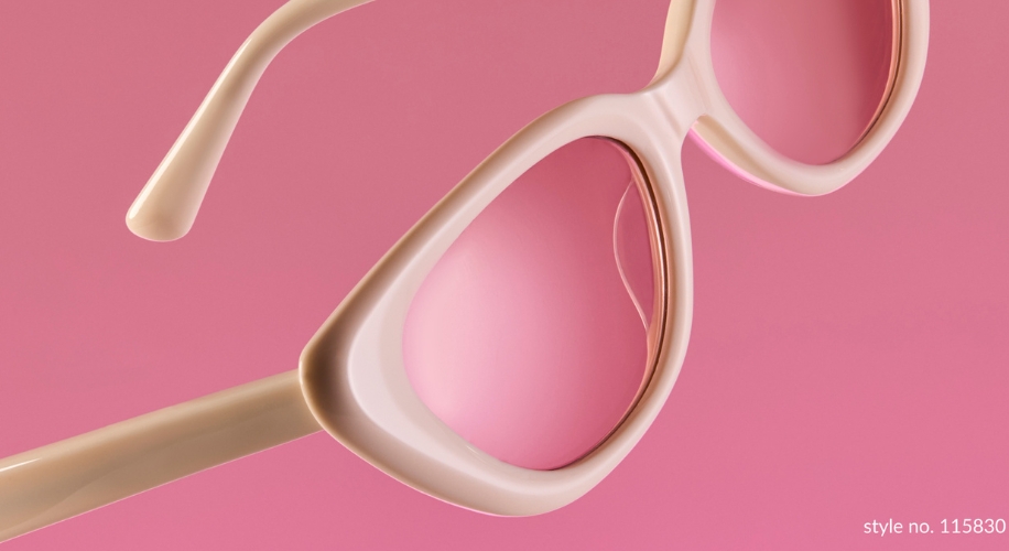 Light beige and pink sunglasses with a rounded design. Text in image: style no. 115830