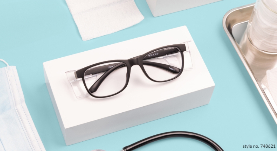 Black-rimmed eyeglasses on a white box. Text on image: &quot;style no. 748621&quot; and &quot;Z83NSP, 748621&quot; on the glasses.