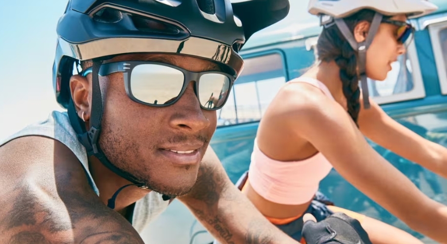 Cyclists wearing helmets and sunglasses.