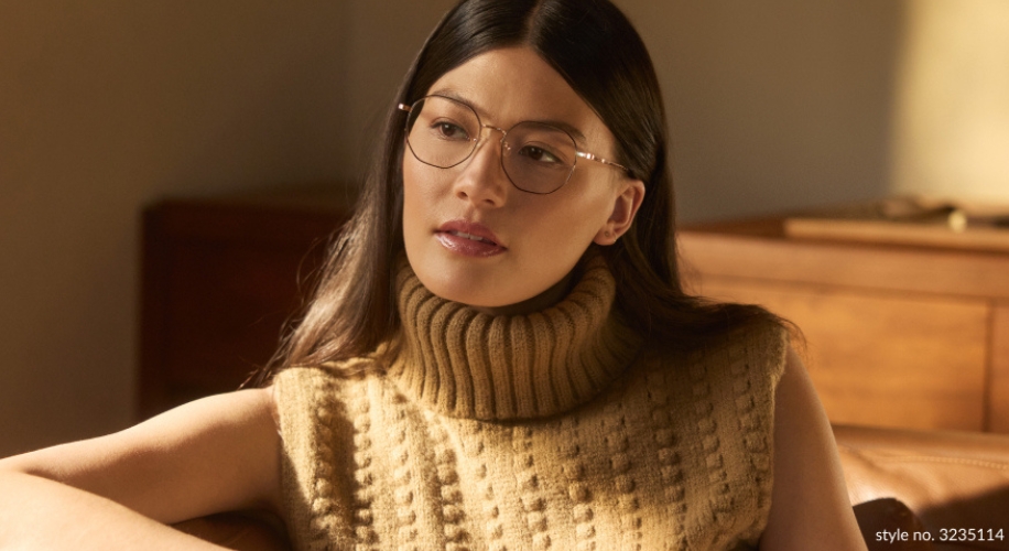 Woman wearing glasses and a beige knitted sleeveless turtleneck sweater. Text: &quot;style no. 3235114&quot;.