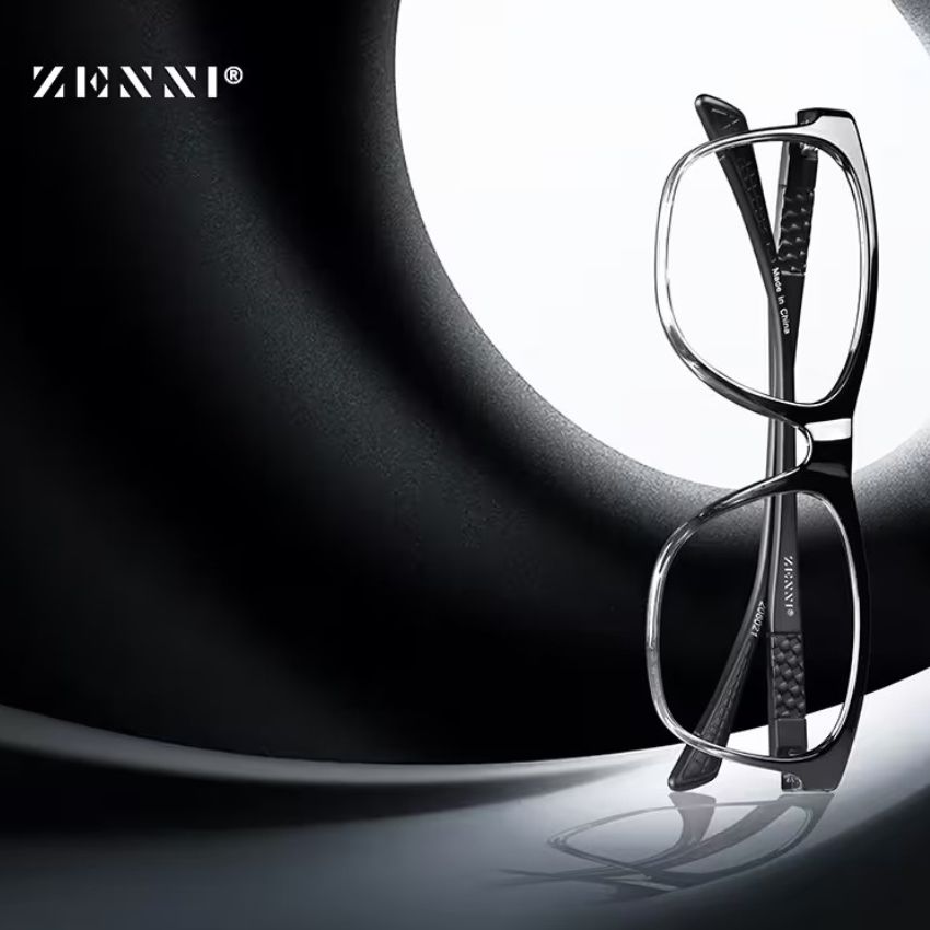Zenni® black eyeglasses with carbon fiber temples against a minimalistic background.