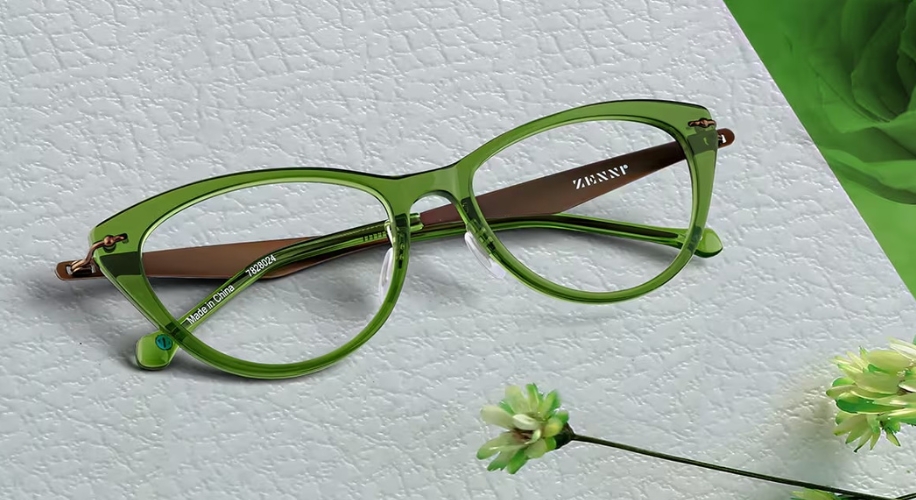 Green cat-eye glasses with &quot;ZENNI&quot; on the right temple and &quot;Made in China ZB02821&quot; on the inner left arm.
