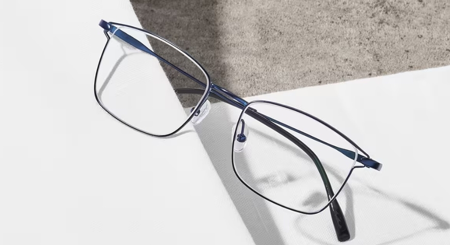 Thin-frame eyeglasses with rectangular lenses and blue temples.