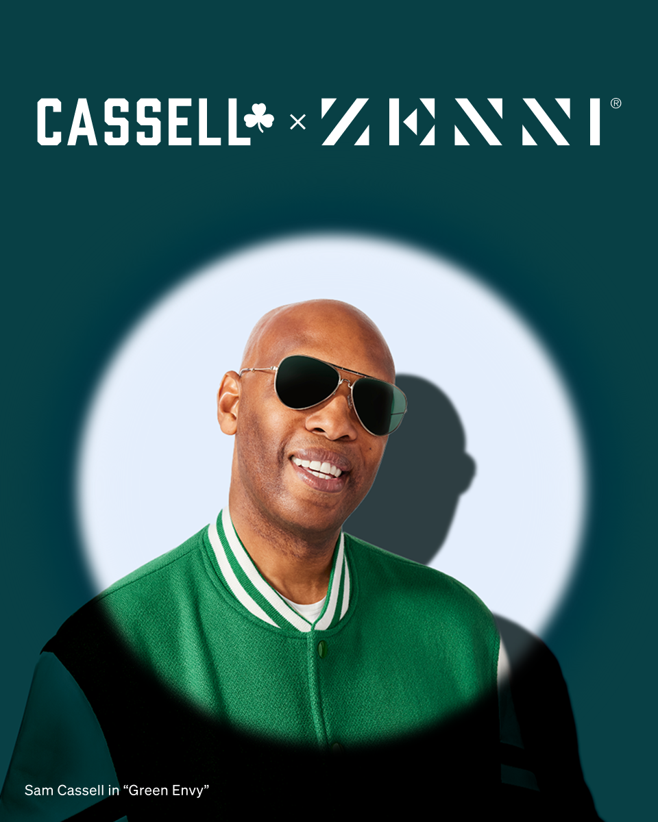 A spotlight shines on Sam Cassell wearing aviator sunglasses