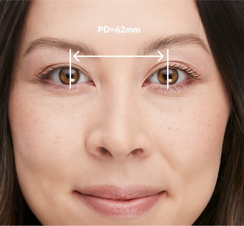 Image of a woman, with a measurement of her pupillary distance of 62mm.