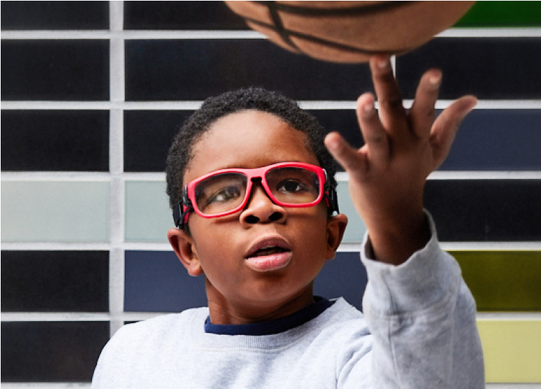 Image of a kid playing basketball, wearing Zenni kids’ sport protective goggles #743318.